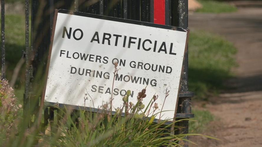 Sign at Green Meadows cemetery warning no items on graves during mowing season