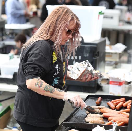 Vendor prepares hot dog