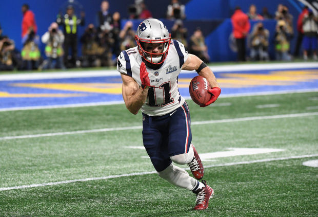 New England Patriots Julian Edelman runs after catching a pass from News  Photo - Getty Images