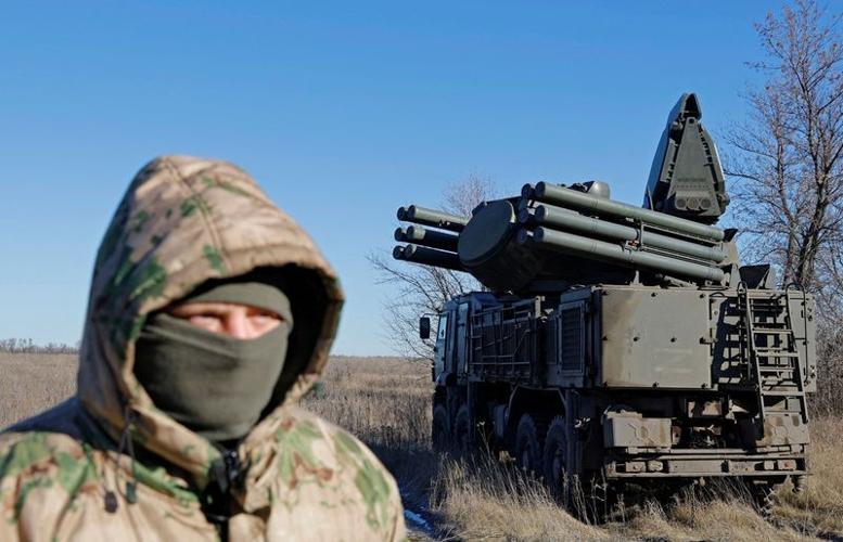 FILE PHOTO: A Russian service member stands in front of a Pantsir anti-aircraft missile system on combat duty in the Luhansk region