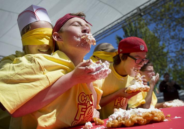 Festival's first Funnel Cake Eating Contest a delightfully messy