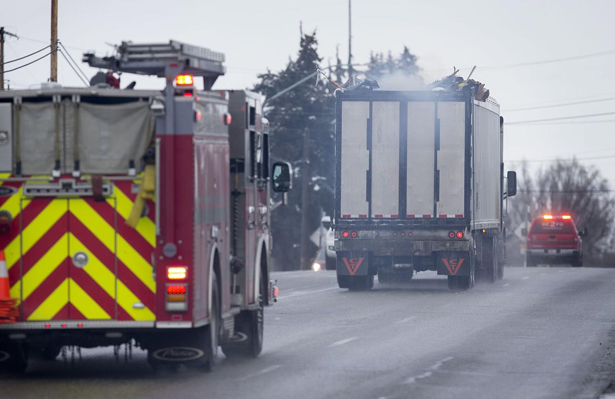 Trailer filled with garbage on fire escorted to dump | Local News