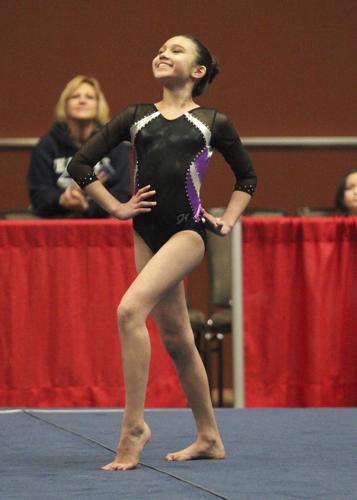 Local gymnast brings home gold, silver from Eastern Championships