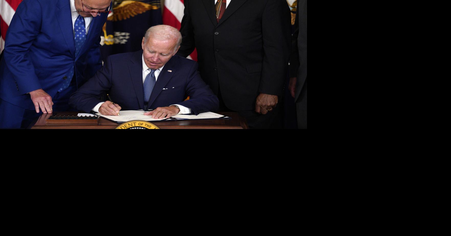 Biden signs climate, drug costs bill into law, a legislative triumph in a moment of democratic peril