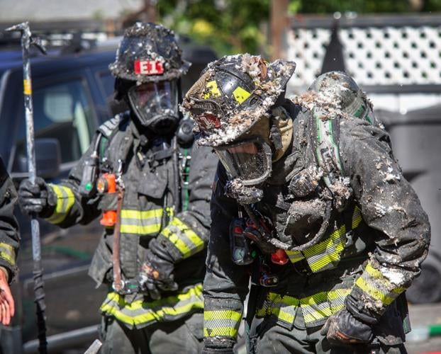 Photos Firefighters get dirty to battle house fire in Rock Island
