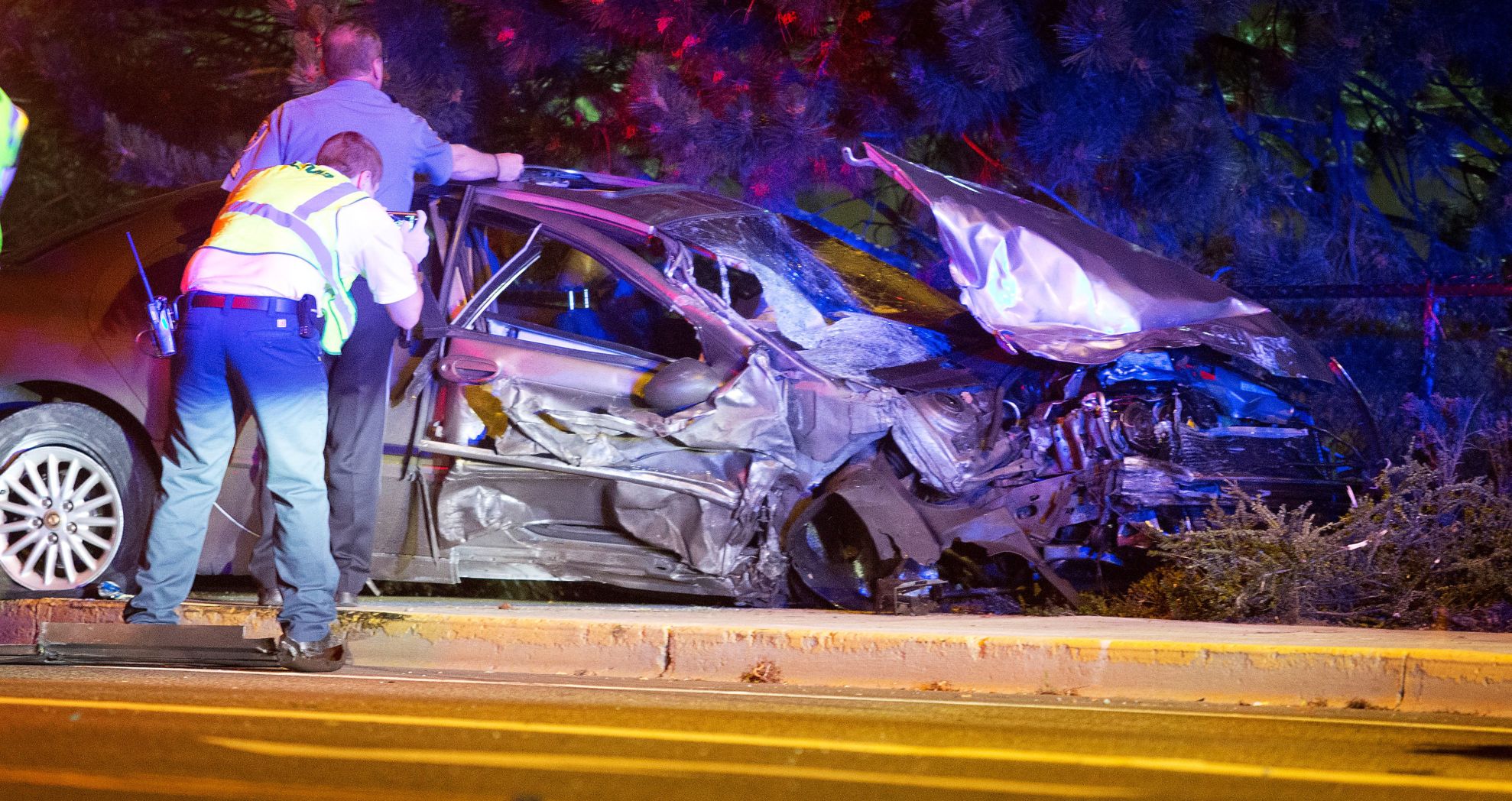 Speeding car crashes into five parked cars at highway intersection