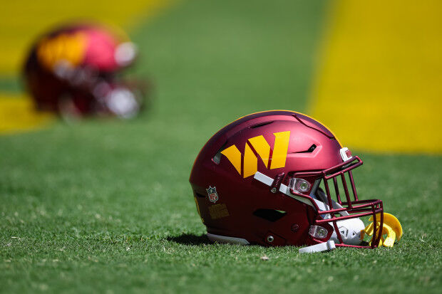 A view of a Washington Commanders helmet on display during a press News  Photo - Getty Images