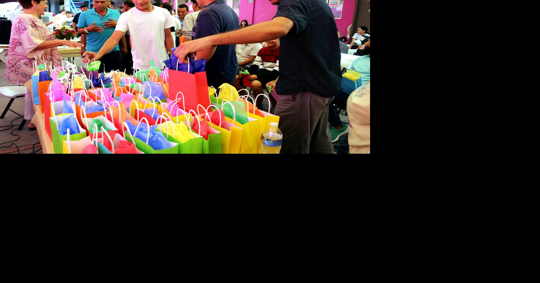 Migrant fathers celebrate their day at a family shelter in Mexico with gifts and prayers