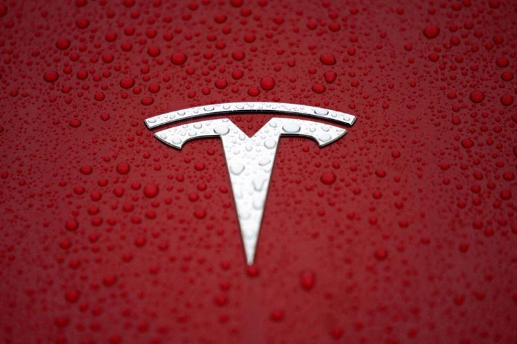 FILE PHOTO: FILE PHOTO: A Tesla logo is seen at a groundbreaking ceremony of Tesla Shanghai Gigafactory in Shanghai