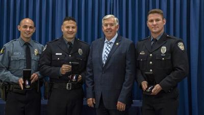 Gov Mike Parson with Chesterfield officers Broeker-Mattaline and Kitrel
