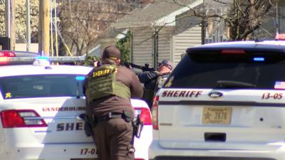 Authorities at the scene of a standoff in Evansville on Monday