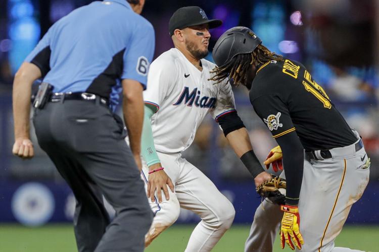 Marlins shortstop gets tooth knocked out but Miami claims a walk-off victory in the 11th