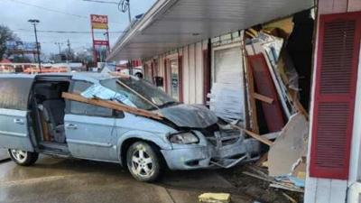 A van crashed through the wall of Royal Deal Vehicle Sales in Evansville on Friday morning