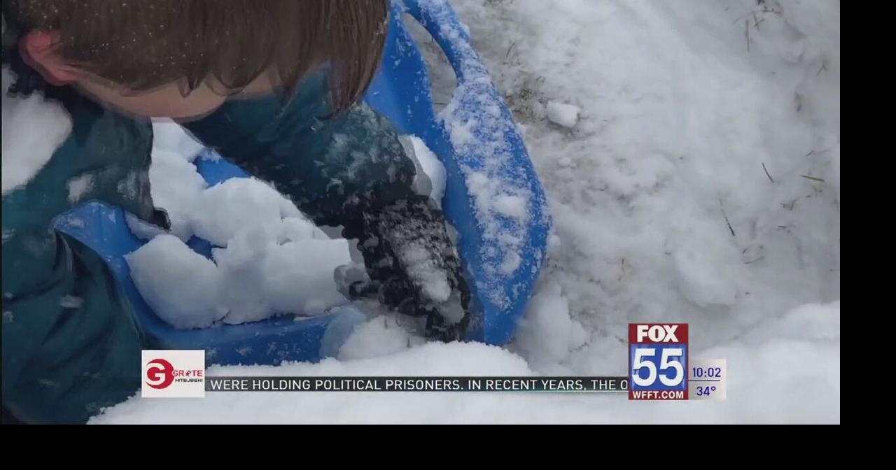 Fort Wayne kids and parents enjoy the first big snowfall of the season