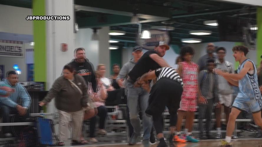 CAUGHT ON CAMERA Parent and referee fight at youth basketball game