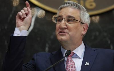 Indiana governor vetoes transgender girls sports ban, signs ...