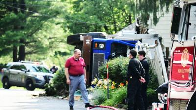 Driver dies after garbage truck crashes into home, rolls | News | wfmz.com