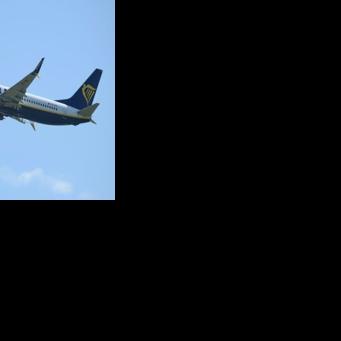 Ryanair said the flight returned to Thessaloniki after the window 'detached', with witnesses describing fellow passengers pulling the man back inside