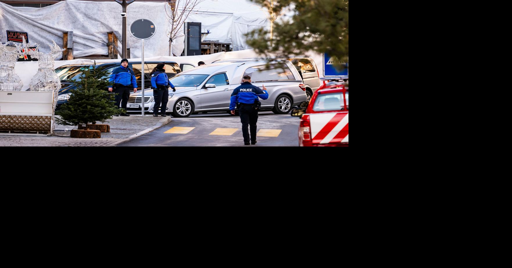 Swiss investigators believe sparkling candles atop wine bottles ignited fatal bar fire