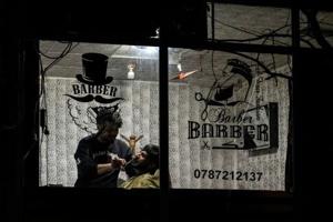 Afghan barbers under pressure as morality police take on short beards