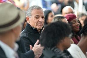 Disney earnings boosted by theme parks, as CEO handover nears