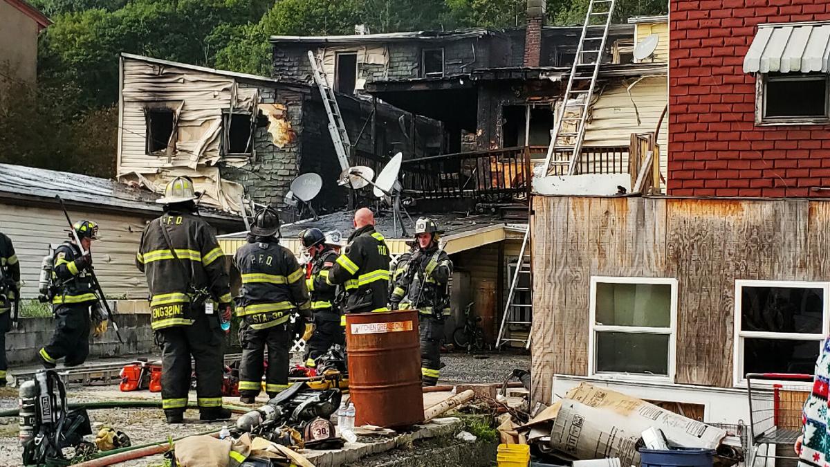 Firefighter hurt after fire tears through row homes in Ashland