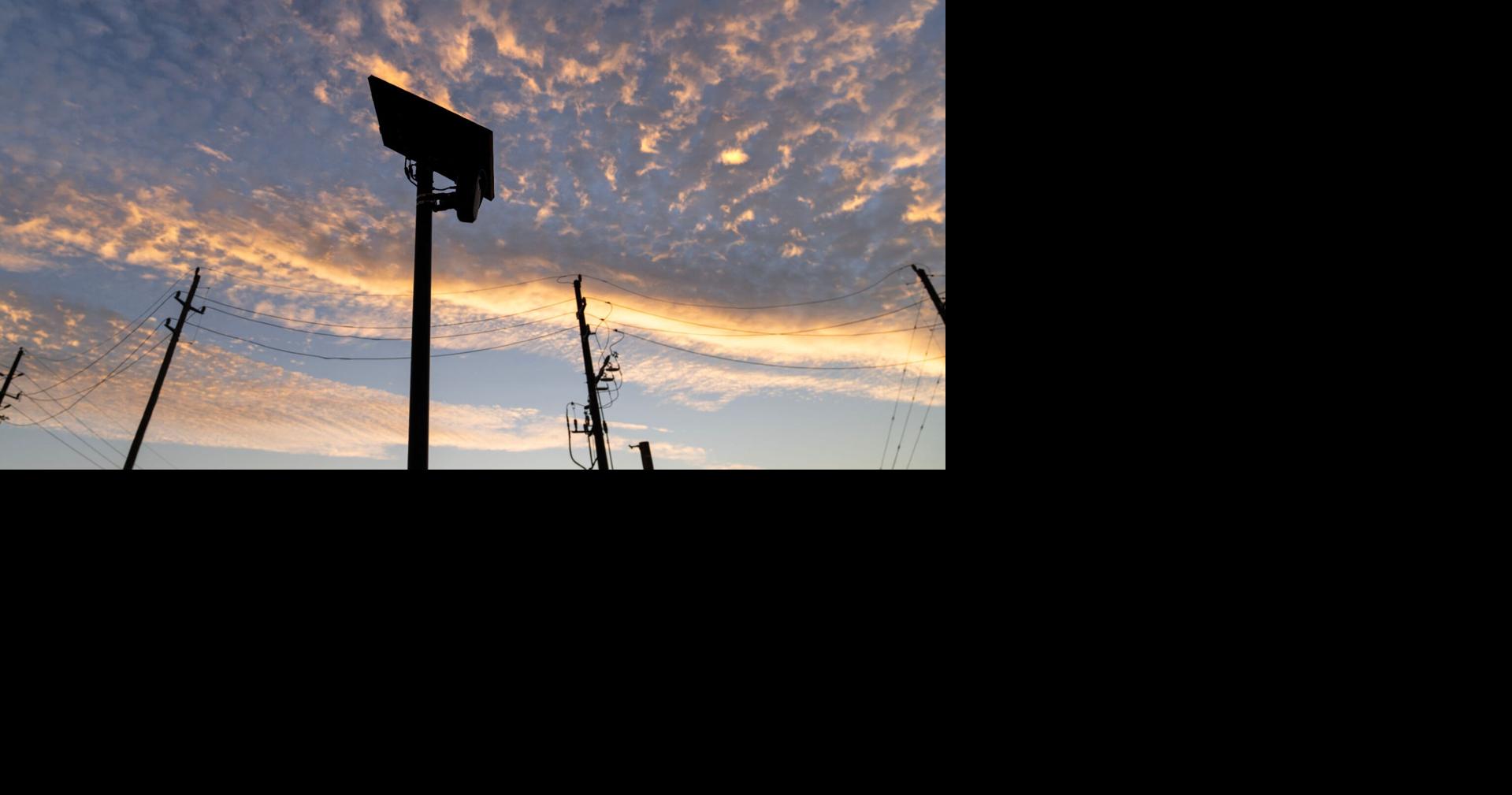 A Flock Safety license plate reader is seen along a public road in Houston, Texas.