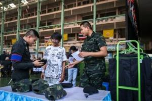 Red or black: Thai men tempt fate at military draft draw