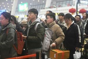Dumplings and work stress as Chinese rush home for Lunar New Year