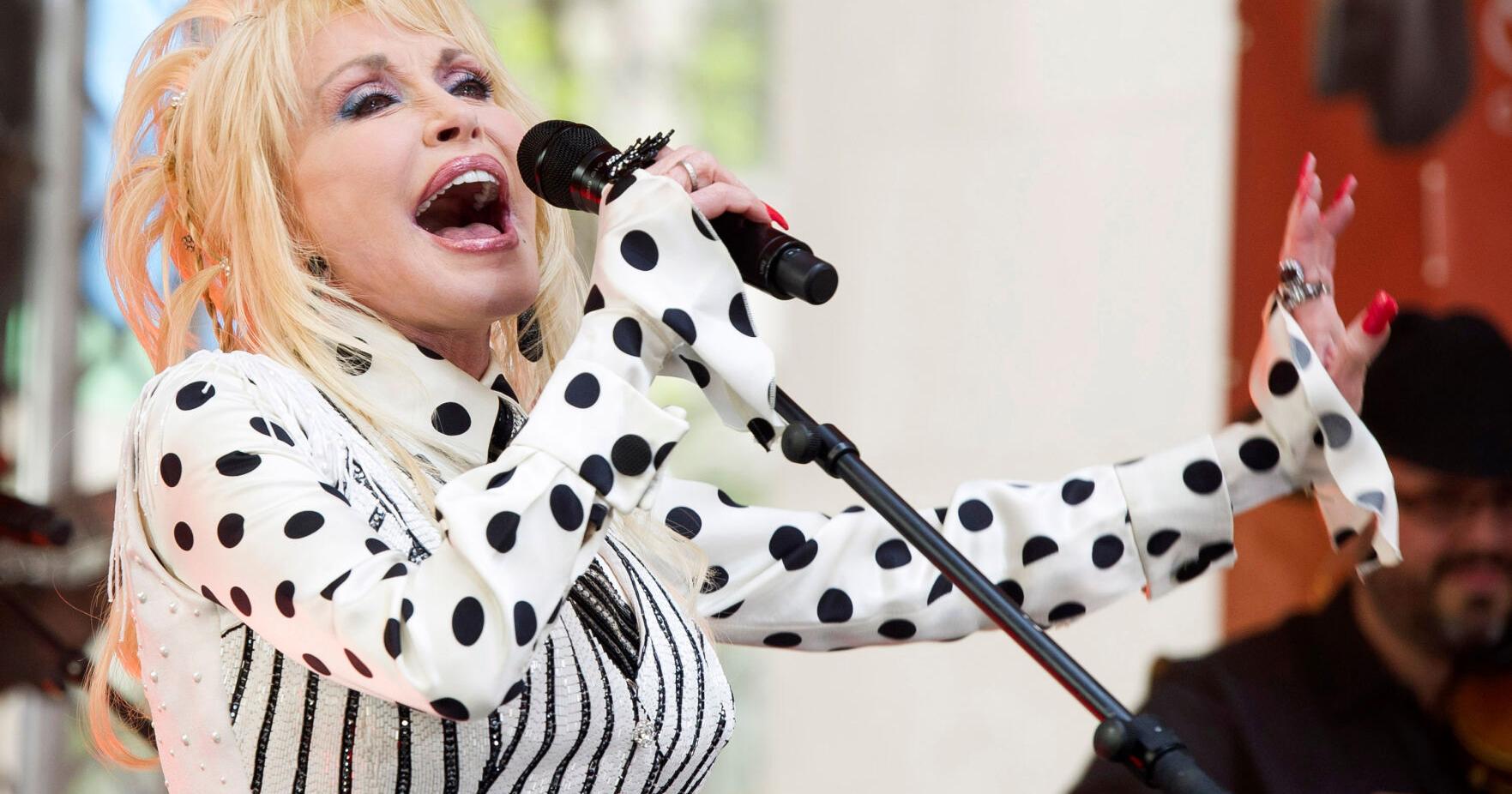 Dolly Parton life and career as a country music icon , actor and philanthropist , in photos | Associated Press