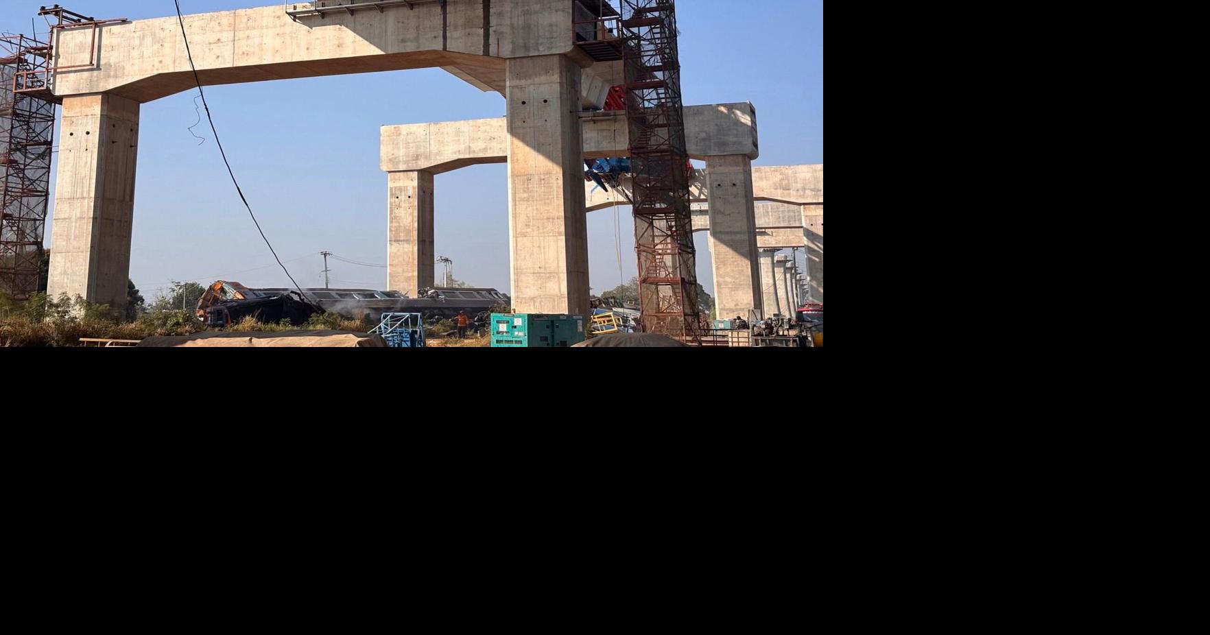 A construction crane falls onto a moving train in Thailand, killing at least 29 people