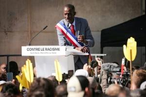 Thousands rally against racism in Paris suburb to defend mayor
