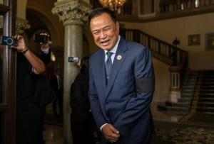 Thai PM agrees coalition with Thaksin-backed party