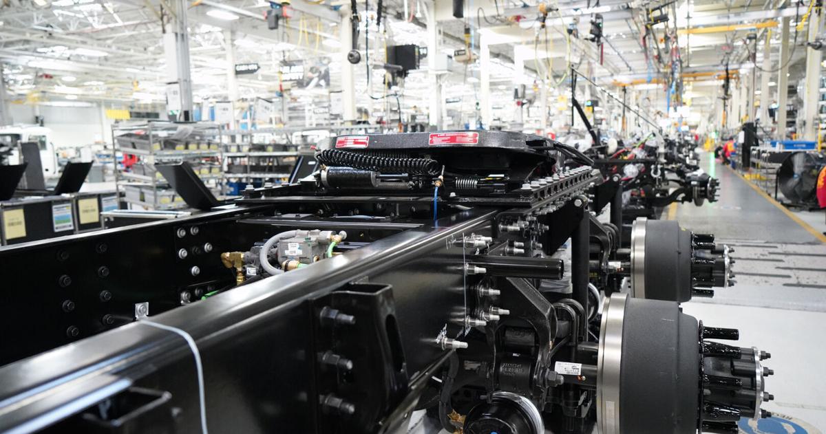 Mack Trucks' parent company trims forecast amid weakened truck market