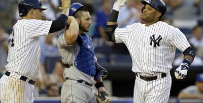 Cano helps M's win in return to Yankee Stadium