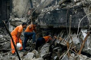 Pakistan rescuers scour blaze site for dozens missing