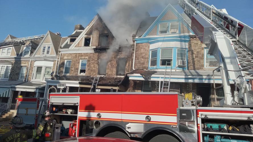 Firefighters battle 3-alarm fire at row house on Spruce St. in Reading ...