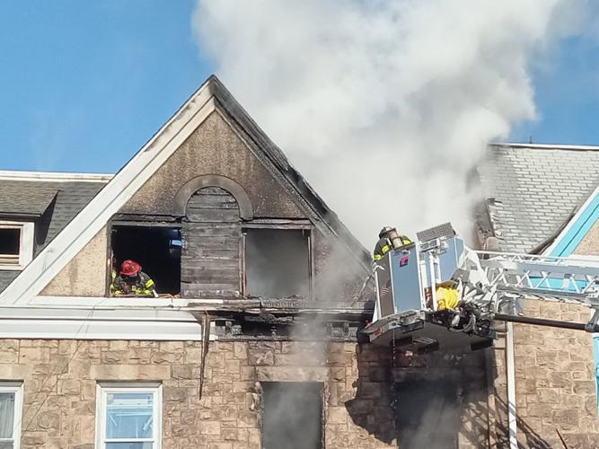 Firefighters battle 3-alarm fire at row house on Spruce St. in Reading ...
