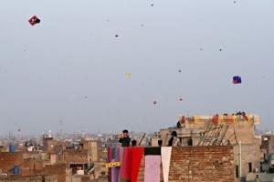 Colour and caution as banned kite-flying festival returns to Pakistan