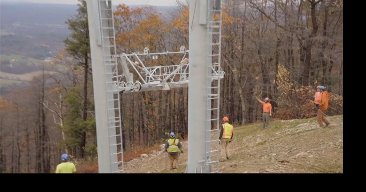 Workers, helicopter pilots install towers for high-speed lift at Blue ...