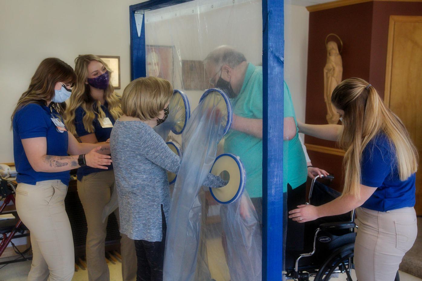 Nursing students with their "Embrace COVID-19" device at St. Vincent's