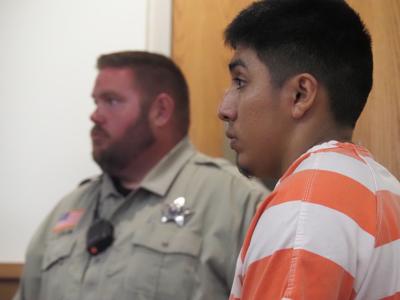 Quincy man charged in TJ Maxx shooting will remain in jail for case