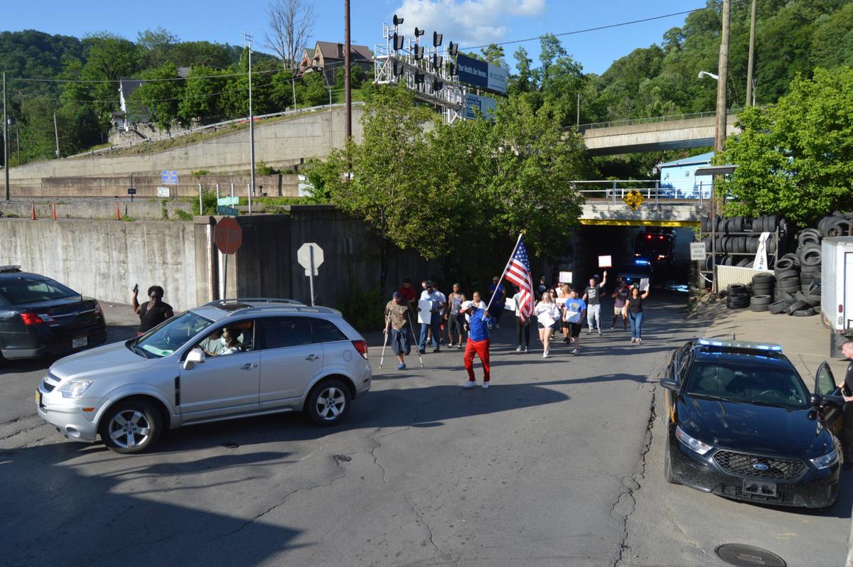 Protesters rally, march alongside police in Williamson News