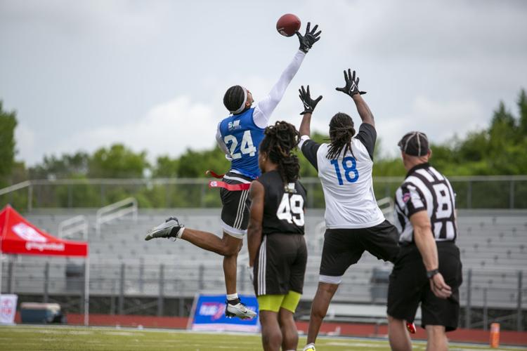Dozens tryout for inaugural pro flag football team helmed by Fairview's  Hughes, Sports