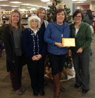 After Secret Santa, Library staff gives to The Well