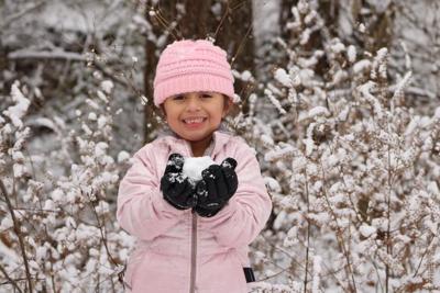 Snow girl with snowball