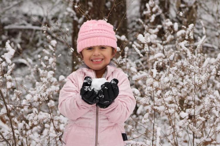 Snow girl with snowball