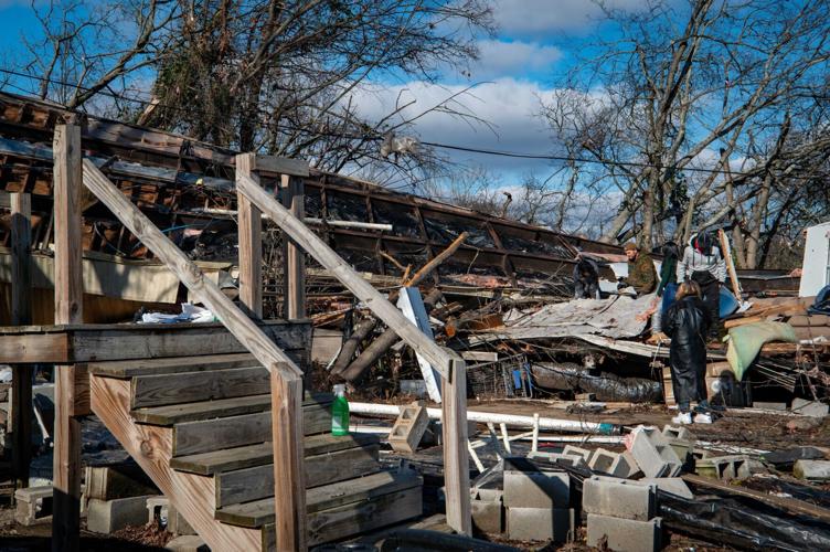 Utility poles, power lines and debris scattered across Madison's Nesbitt Lane on Dec. 10