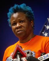 Gun control advocate Shaundelle Brooks moves toward House run