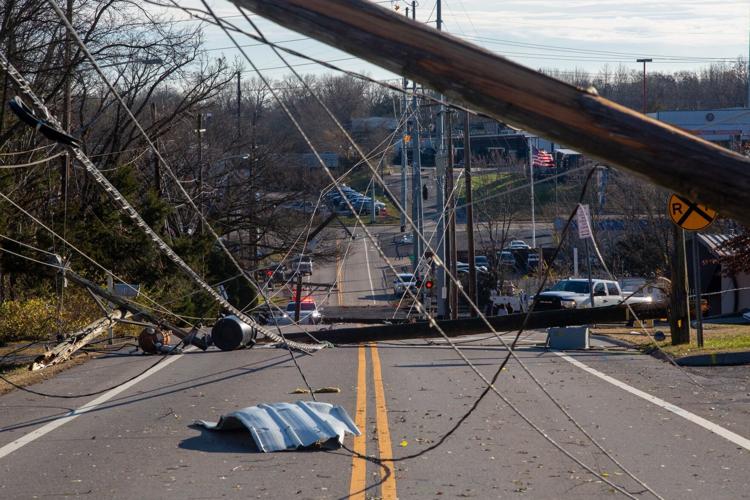 Utility poles, power lines and debris scattered across Madison's Nesbitt Lane on Dec. 10
